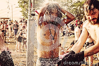 Woodstock Poland Rock festival visitor taking shower Editorial Stock Photo